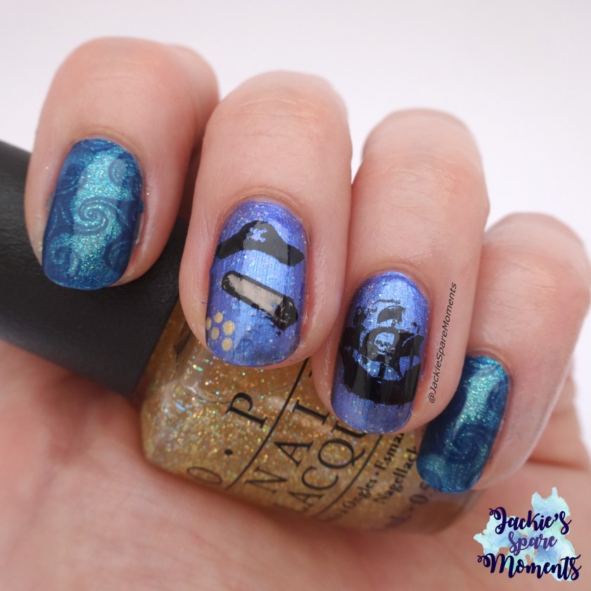 Macro shot of pirate manicure holding OPI I don't speak meek