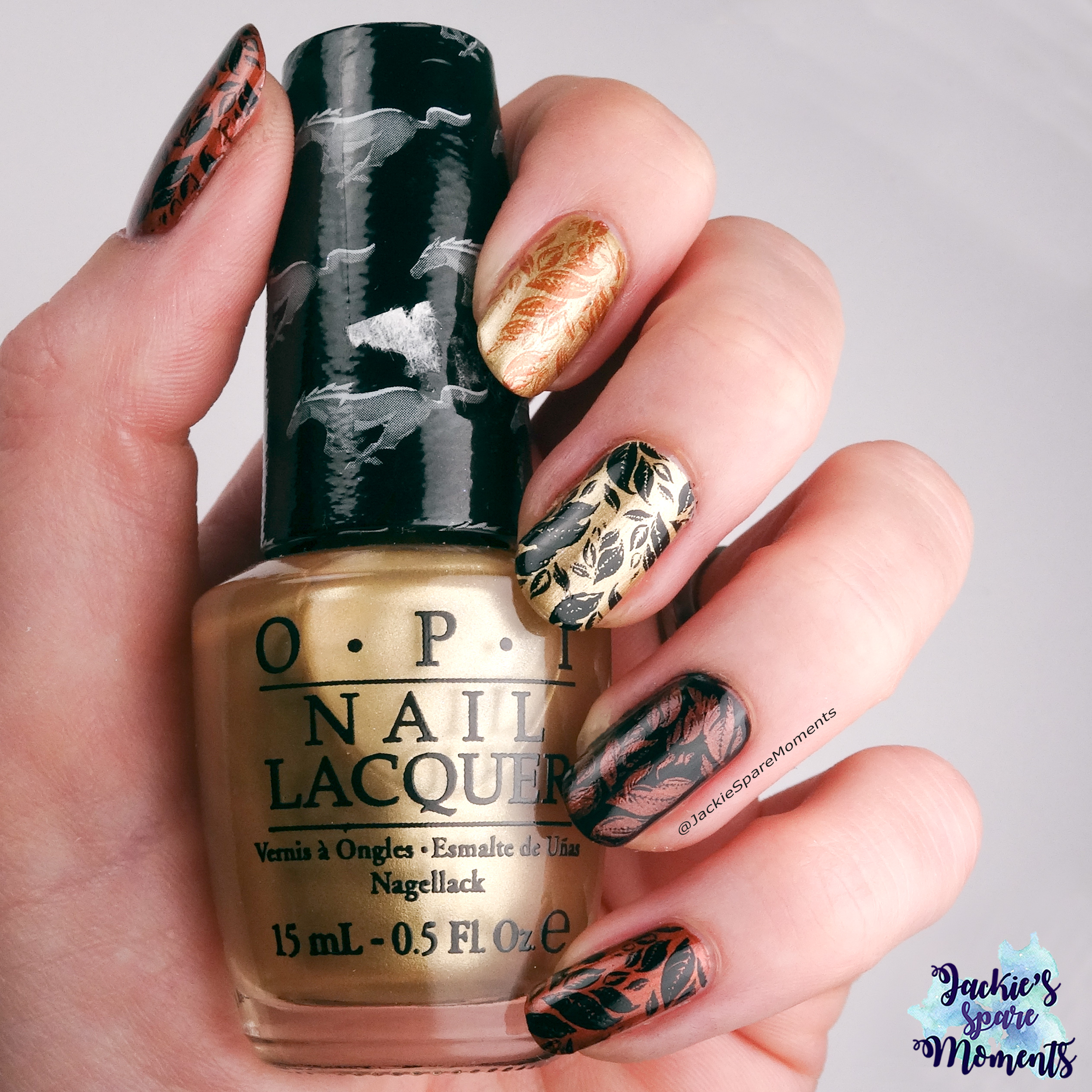 Autumn leaves in Gold, Copper and Black. Holding OPI 50 years of style
