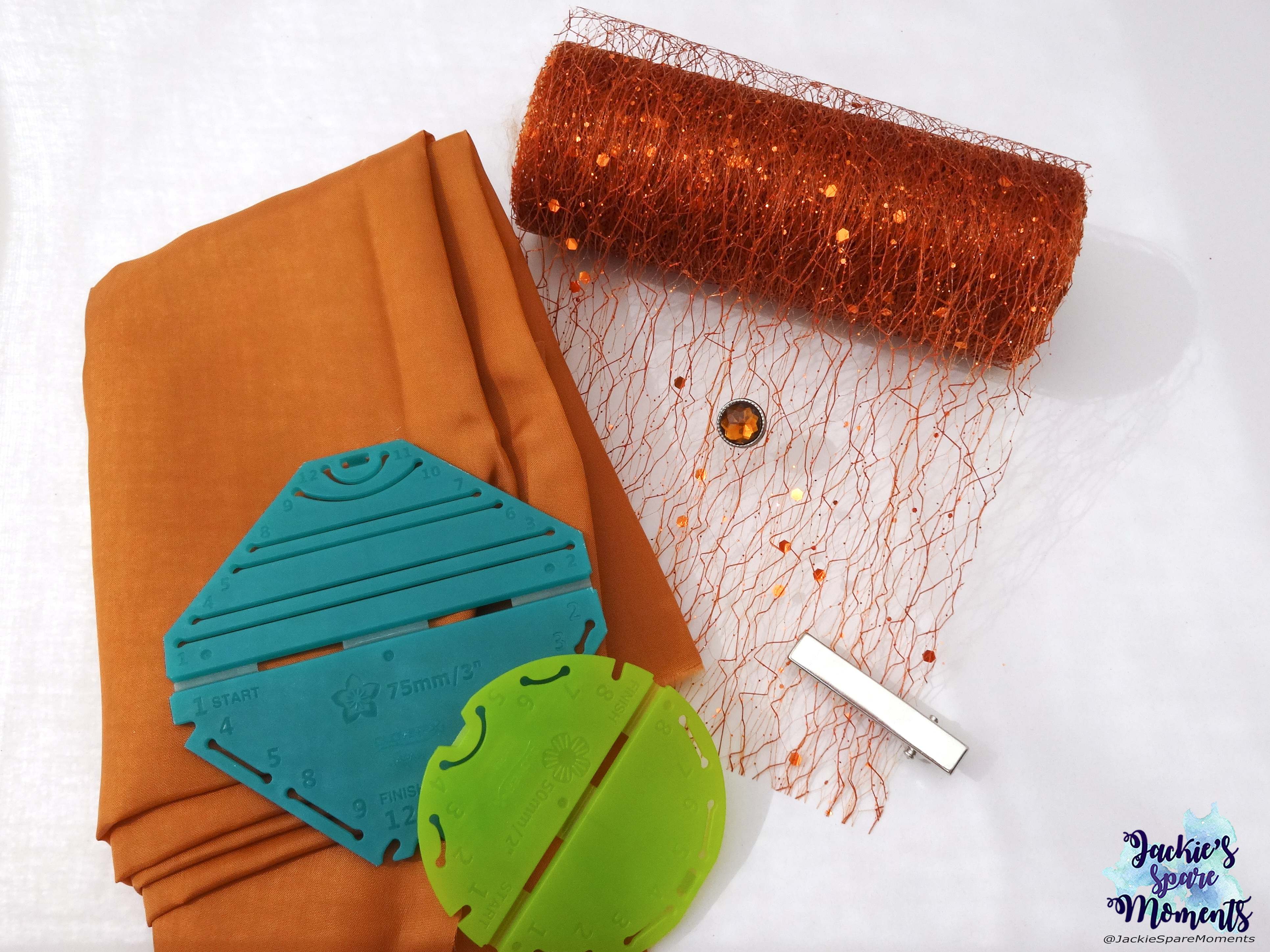 Materials used for floral hair bow: light coppery brown satin, fantasy fabric organza, Clover Kanzashi Flower Maker Pointed Petal large, Clover Kanzashi Flower Maker Orchid Petal small, centre stone and alligator clip