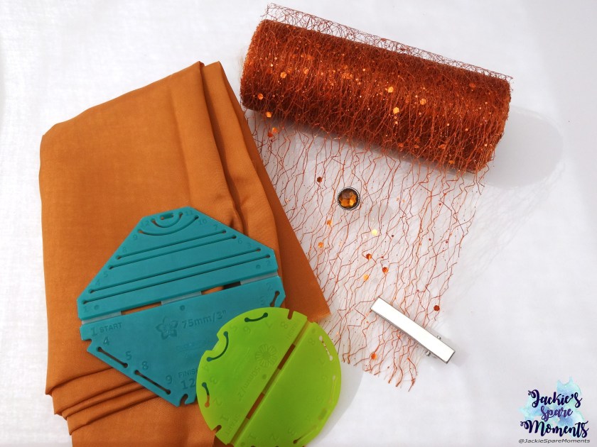 Materials used for floral hair bow: light coppery brown satin, fantasy fabric organza, Clover Kanzashi Flower Maker Pointed Petal large, Clover Kanzashi Flower Maker Orchid Petal small, centre stone and alligator clip