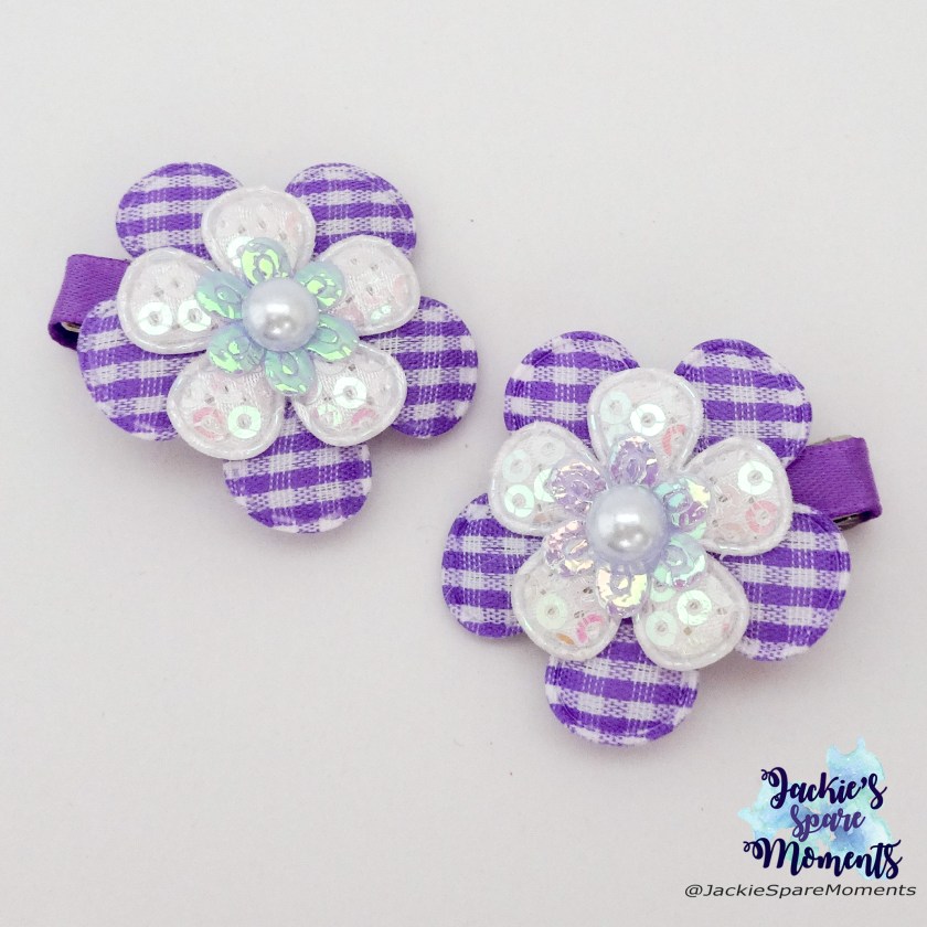 Purple and white floral hair clips