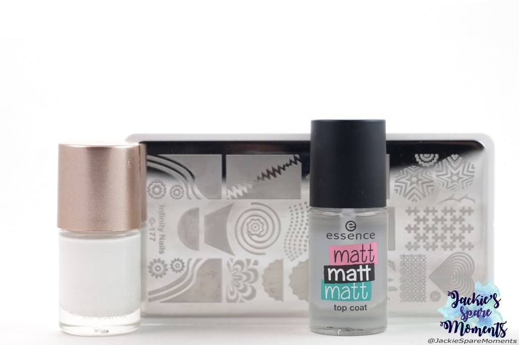 Materials used for negative space nail art: white stamping polish, matte top coat, Dashica stamping plate Infinity Nails 177