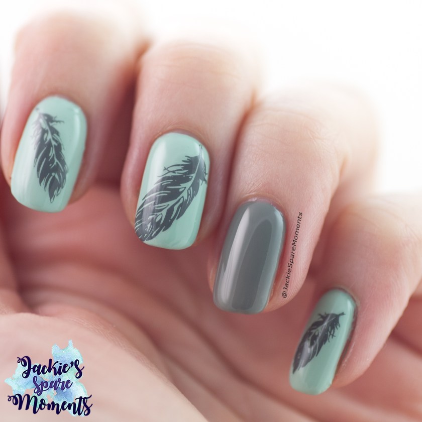 Nail art in grey and mint with stamped feather images