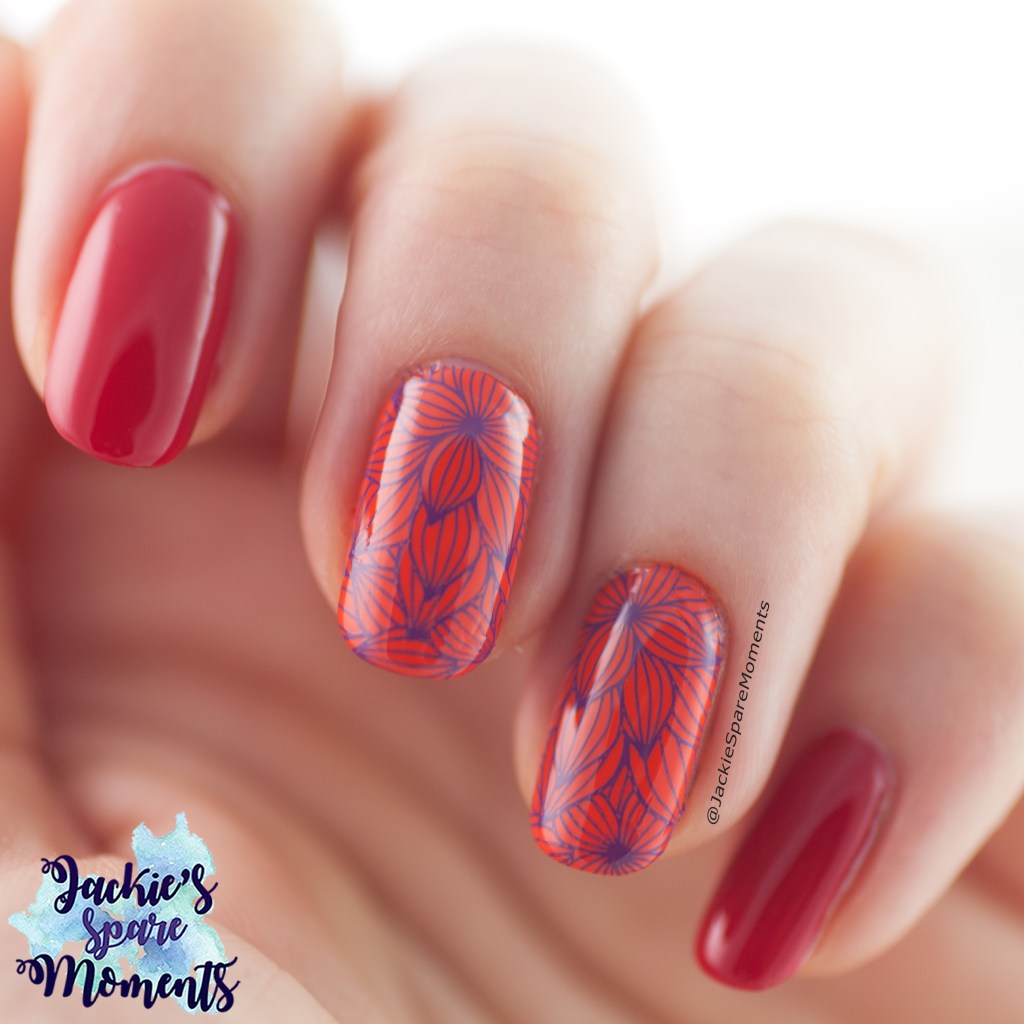 Manicure with red, orange and floral purple stamping