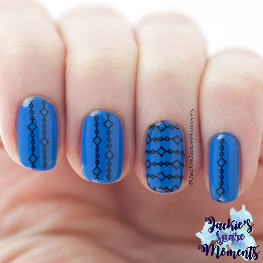 Geometric nail art in blue with black stamping