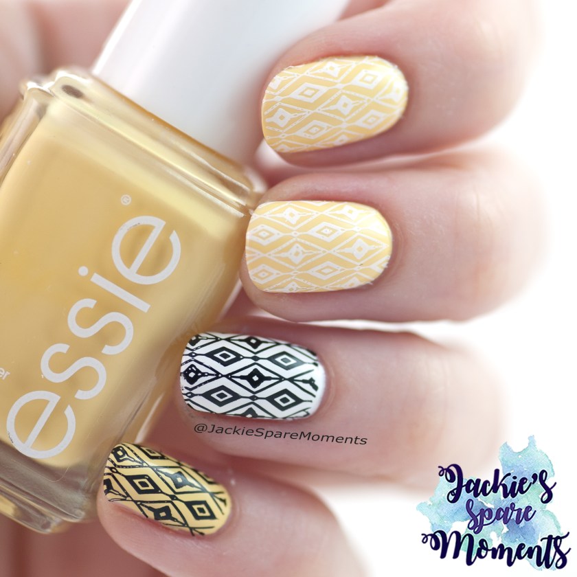 Nail art in yellow, black and white