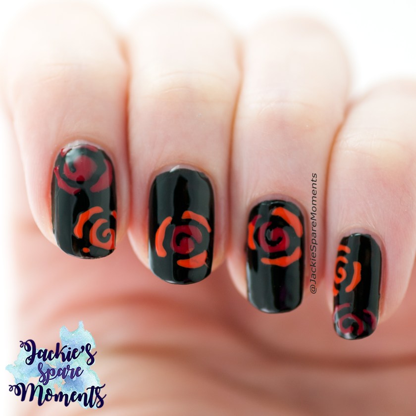 Nail art with orange and red roses on a black background