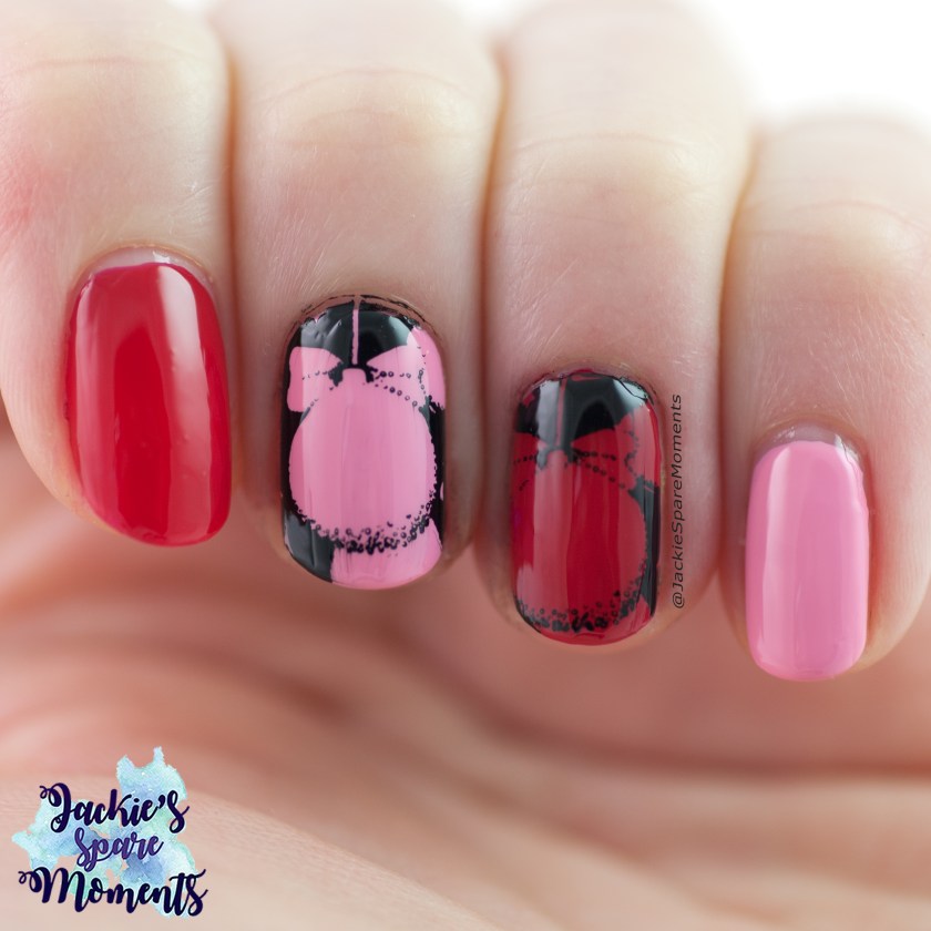 Prink red and black nail art with Christmas ornaments