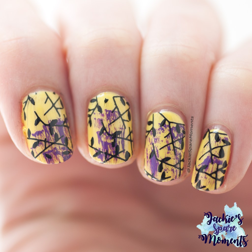 Yellow nails with purple dry brush and black stamping