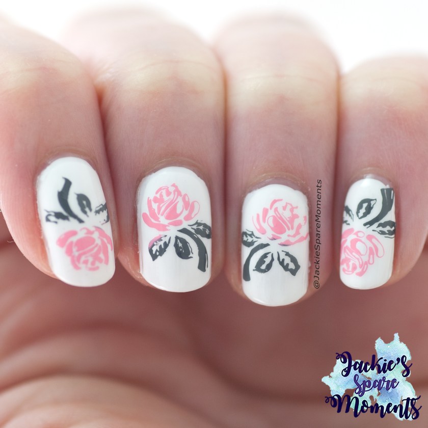 Stamped roses nail art in white, grey and pink.