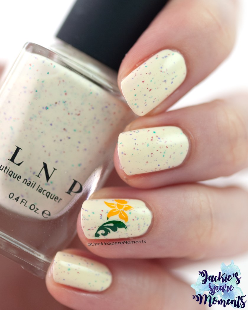 soft yellow speckled polish with flower narcissus image
