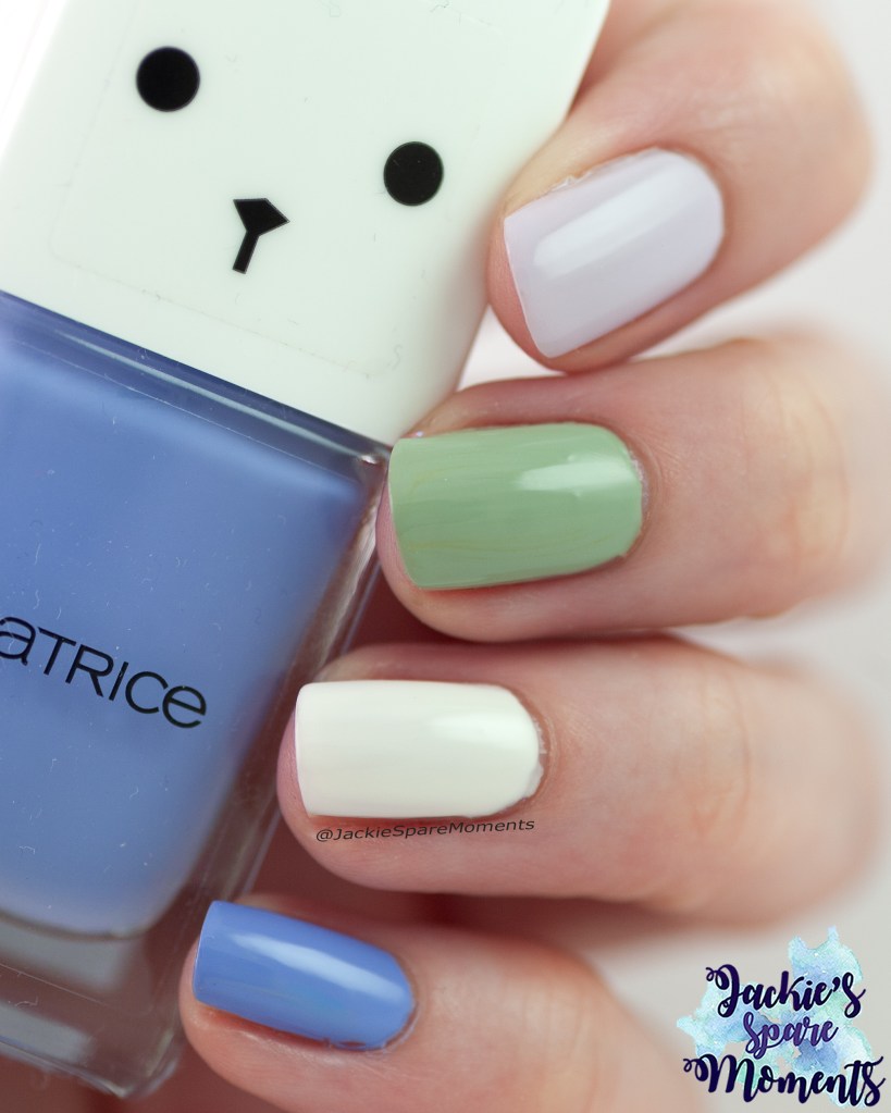 spring skittle manicure with lilac, white, green and blue